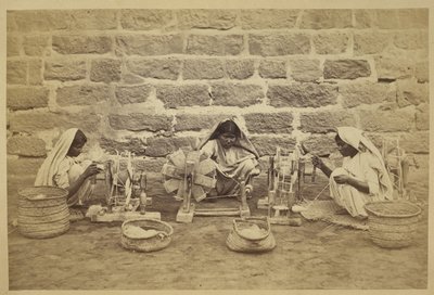 Female prisoners winding cotton on spinning wheels in Karachi Prison. Photographer: Michie and Company c. 1873. Archaeological Survey of India Collections: India Office Series (Volume 52) by English Photographer