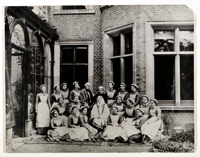 Florence Nightingale with Sir Harry Verney and Miss Crossland, in the centre of a group of nurses at Claydon House, 1886 by English Photographer