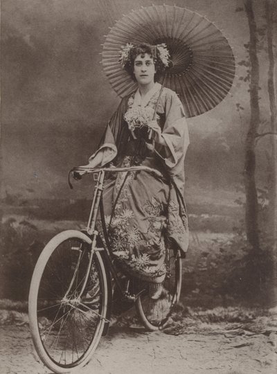 Girl on bicycle, dressed in the Japanese fashion by English Photographer