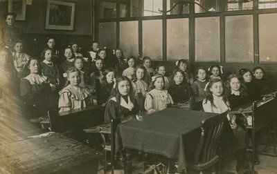 Girls Sitting in a Classroom by English Photographer