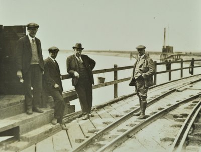 Group of men at Becontree Estate by English Photographer