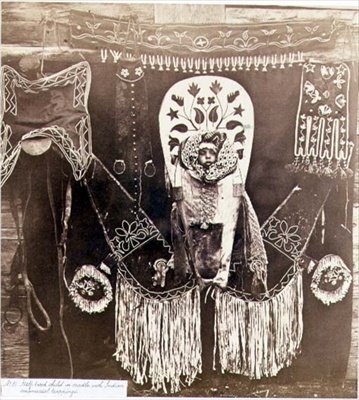 Half-Breed Child in a Cradle with Indian Ornamental Trappings, Photographed by the Royal Engineers on the Forty-Ninth Parallel by English Photographer