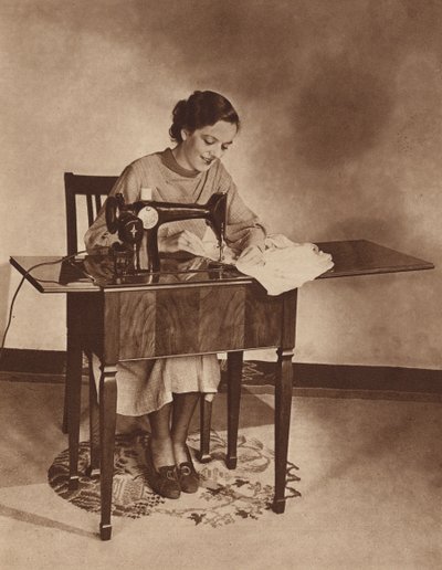 Housewife at Work on the Sewing-Machine by English Photographer