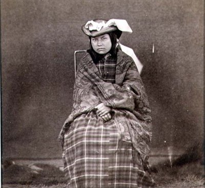 Indian Woman in Western Clothes, photographed by the Royal Engineers on the Forty-Ninth Parallel by English Photographer