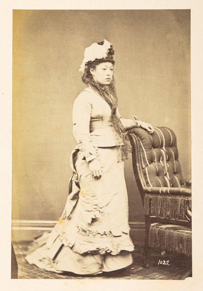 Japanese woman in European dress, Full-length standing studio portrait by English Photographer