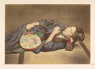 Japanese woman sleeping, Three-quarter length studio portrait by English Photographer