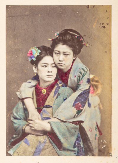Japanese Women in Traditional Dress, Three-quarter Length Portrait of Two Young Women, One Seated, the Other Leaning Over Her Shoulder with Her Arms Around Her by English Photographer