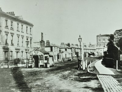 Kilburn Toll Gate at south end of Kilburn High Road by junction of Kilburn Priory, Camden Libraries by English Photographer