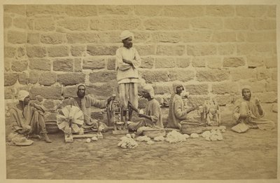 Male prisoners winding cotton on spinning wheels in Karachi Prison by English Photographer