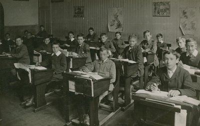 Male Pupils Sitting Behind Their Desks During a Lesson at School by English Photographer