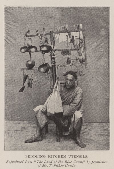 Peddling Kitchen Utensils by English Photographer