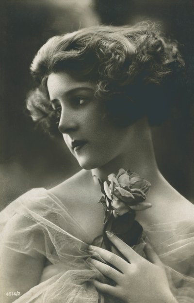 Portrait of a beautiful young woman with a rose by English Photographer