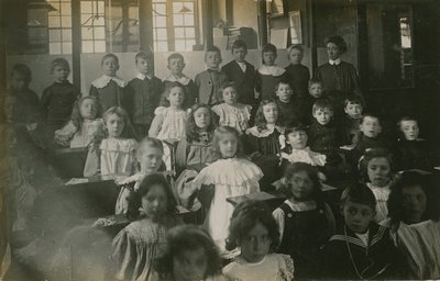 Pupils Sitting Behind Their Desks as They Pose for a Portrait by English Photographer