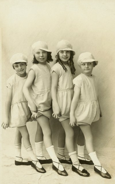 Row of four girls pointing their toes by English Photographer