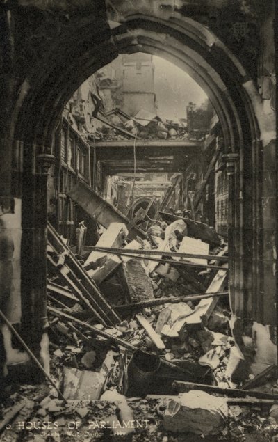The Houses of Parliament, London, showing bomb damage during WW2 by English Photographer
