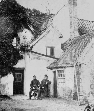 Two Men Outside Enfield Cottage, c.1890 by English Photographer
