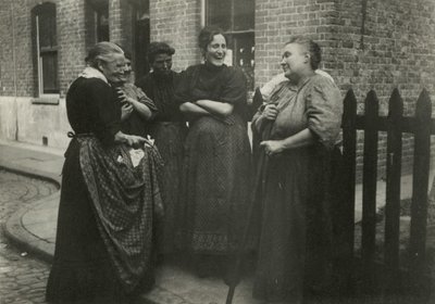 Women Talking in the Street, London by English Photographer