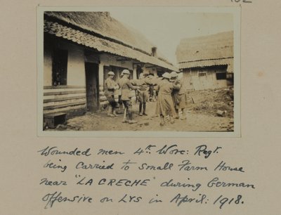 Wounded men, 4th, Worc: Regt. being carried to small farm house near 