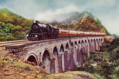 4-6-2 steam locomotive of the Bombay, Baroda and Central India Railway hauling the Frontier Mail passing over a viaduct between Bombay and Delhi by English School