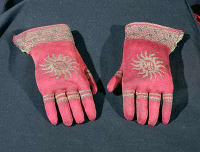 A pair of knitted silk gloves, possibly once belonging to Archbishop William Warham, late 15th or early 16th century by English School