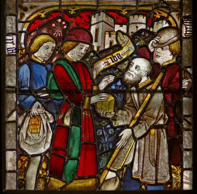 A panel in the east window depicting the Works of Mercy: feeding the hungry by English School