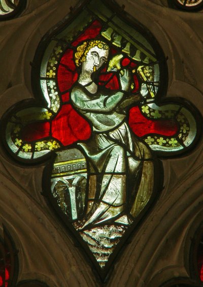 A window in the Lady Chapel depicting a musician angel with bells by English School