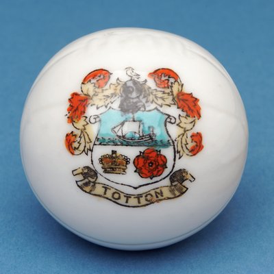 Armorial souvenir miniature football with transfer of the Totton crest (ceramic) by English School