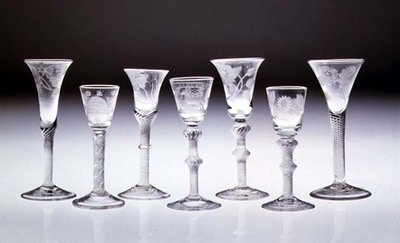 Collection of engraved glasses with opaque and air twist stems by English School