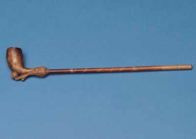 Cup tie pipe with bamboo stem and carved boot kicking a ball underneath (clay) by English School