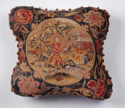 Cushion, embroidered in petit point, depicting a shepherd in a landscape by English School