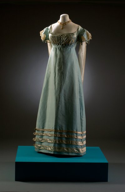 Duck egg blue evening dress with cream sleeves, shown here with pearl jewellery, c.1819 by English School