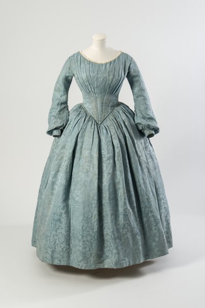 Light blue flowered silk dress with shaped pointed bodice and long full sleeves by English School