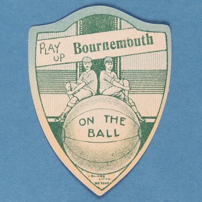 Play Up Bournemouth, Baines Card in the Shape of a Shield and Two Footballers Sitting on Top of a Large Football, 1888-89 by English School