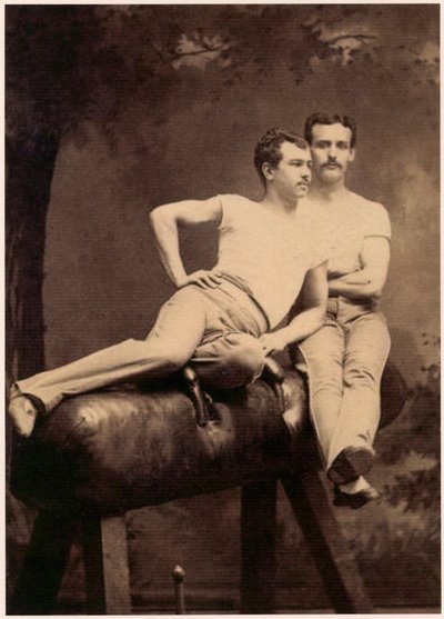 Portrait of two Gymnasts posing on a Pommel Horse by English School