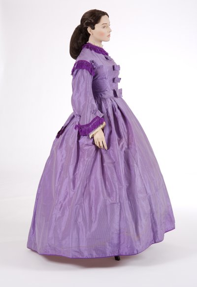 Side view of a purple day dress, 1860s by English School
