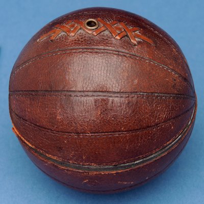 String dispenser in the shape of a football (leather) by English School
