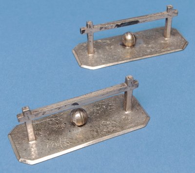 Table-knife rests in the form of goalposts and footballs by English School