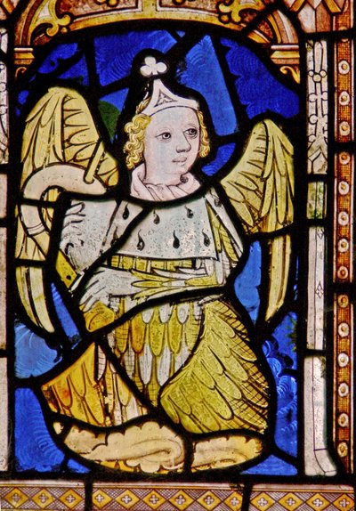 The East window depicting a musician angel with cornamuse by English School