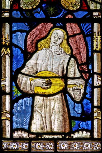 The East window depicting a musician angel with lute by English School