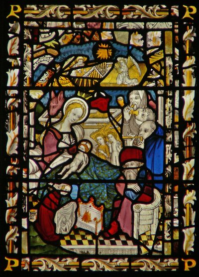 The east window depicting the Adoration of the Shepherds by English School