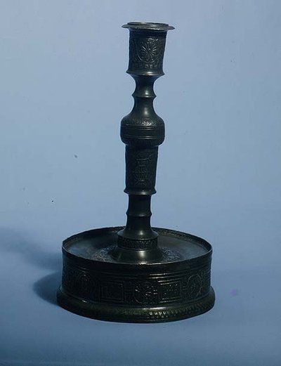 William Grainger candlestick with relief cast decoration, dated 1616 by English School