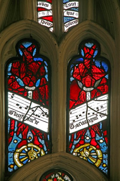 Window depicting angels on wheels with antiphons by English School