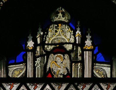 Window depicting a canopy with a musical angel by English School