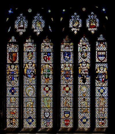 Window St Nectan Chapel Sw depicting angels with shields of arms; reset angels, heads and roundels. the four Evangelists symbols by English School