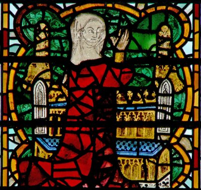 Window depicting a pilgrim at shrine by English School
