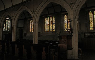 Window depicting a view of the north aisle with fifteenth century stained glass windows by English School