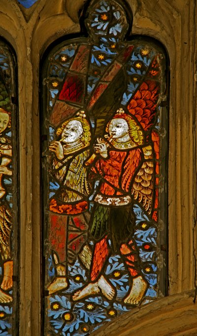 Window depicting musician angels with pipes by English School