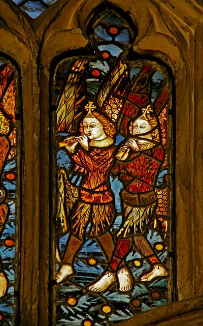 Window depicting musician angels with pipes by English School