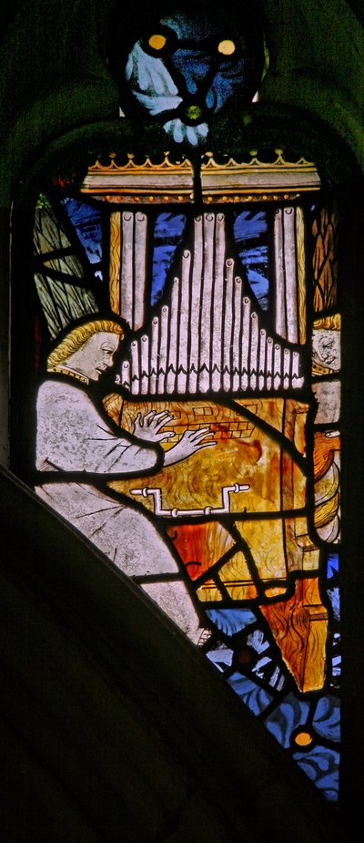 Window depicting musician angels with an organ by English School