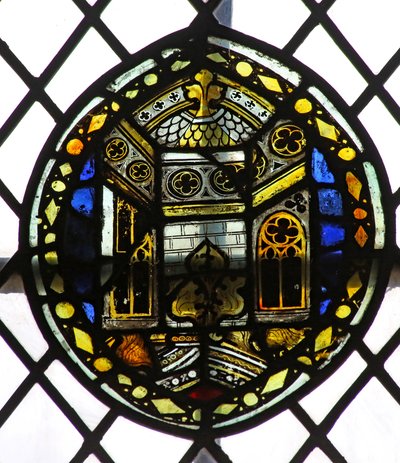 Window s4 depicting a shield with architectural detail by English School